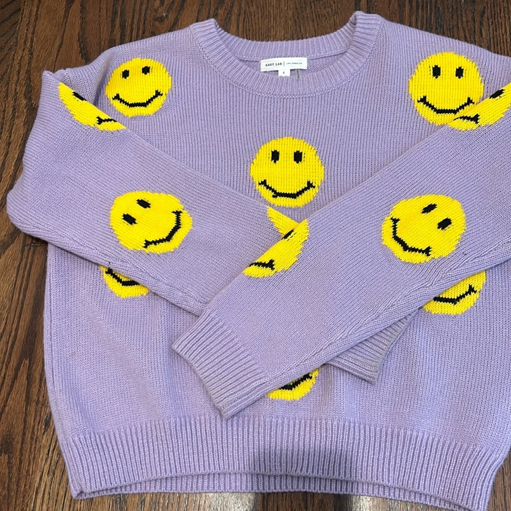 Smiley face purple sweater